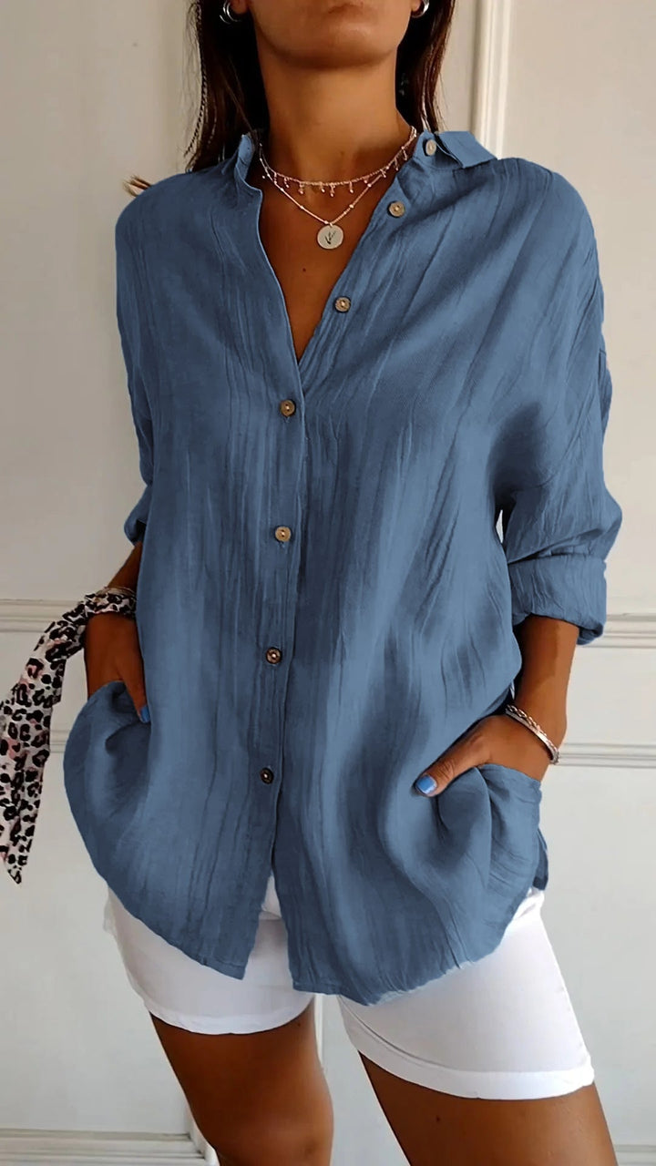 Versatile women's long sleeve button-up shirt, relaxed fit, suitable for workwear and chic everyday fashion.