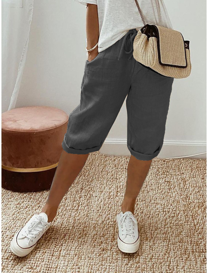 Mid-calf hem detail of women's relaxed fit capri pants, comfortable for summer fashion.