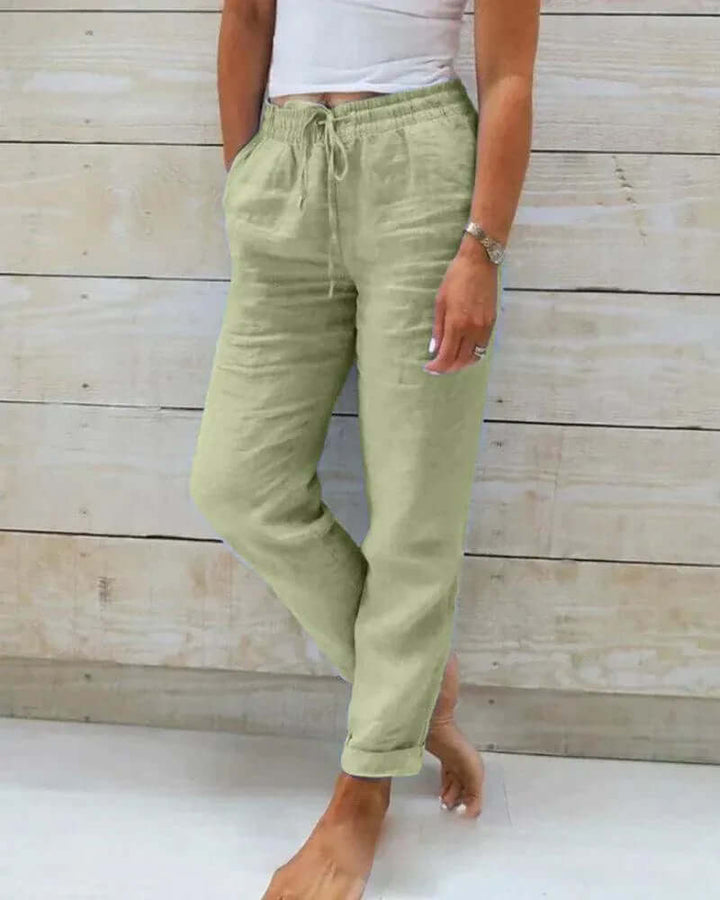 Women's relaxed fit linen trousers with elastic waist & drawstring, perfect for breathable casual summer style.