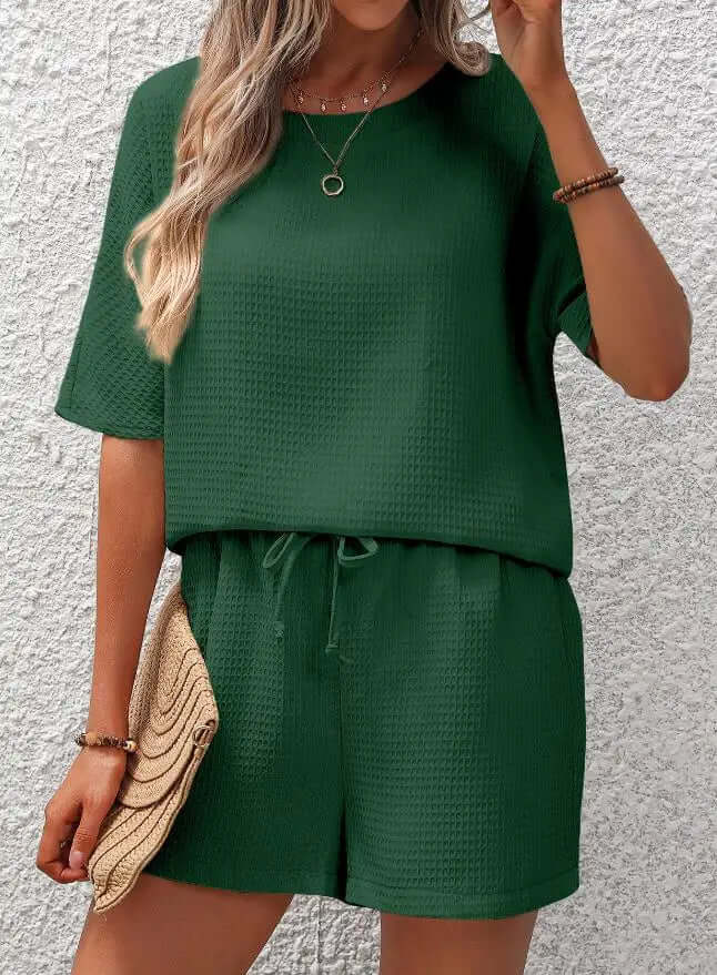 Stylish women's relaxed fit loungewear set. Comfortable two-piece polyester outfit for casual or everyday fashion.