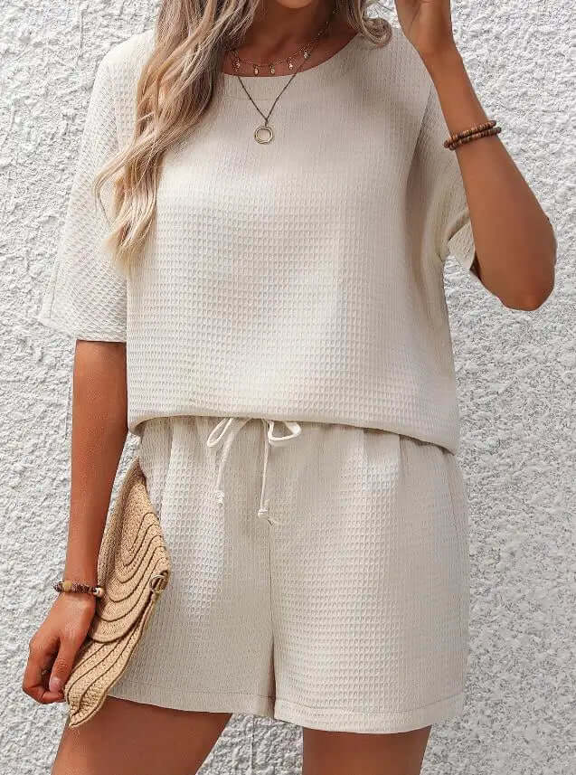 Chic women's apparel: cozy, relaxed fit two-piece loungewear set. Soft polyester for comfortable casual outfits.