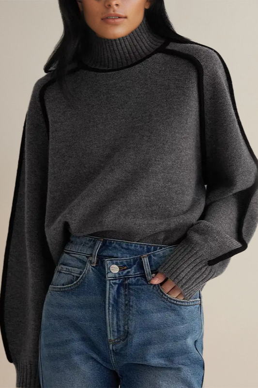 Cozy women's relaxed knit turtleneck sweater, a versatile piece for elegant winter and fall layering.