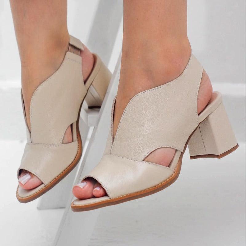 Angled shot of Women's Selina heeled sandals. Shows stylish leather & comfortable everyday design.