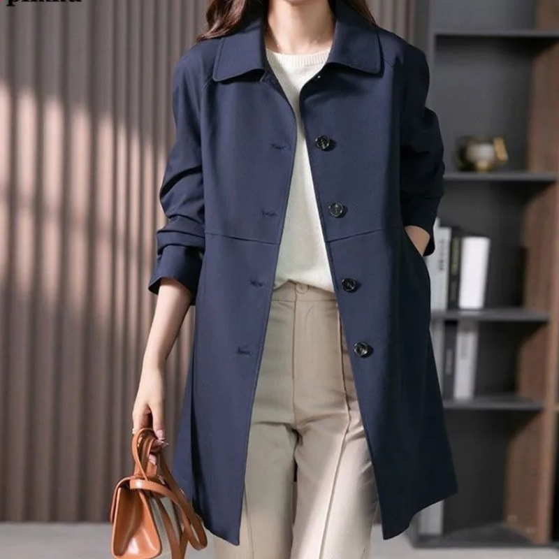 Stylish women's button-up short trench coat. Perfect versatile jacket for casual chic or workwear.