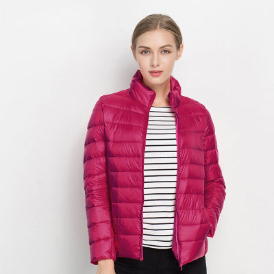 Modern women's zip-up quilted puffer jacket with a stylish stand collar. Essential casual fall/winter outerwear.
