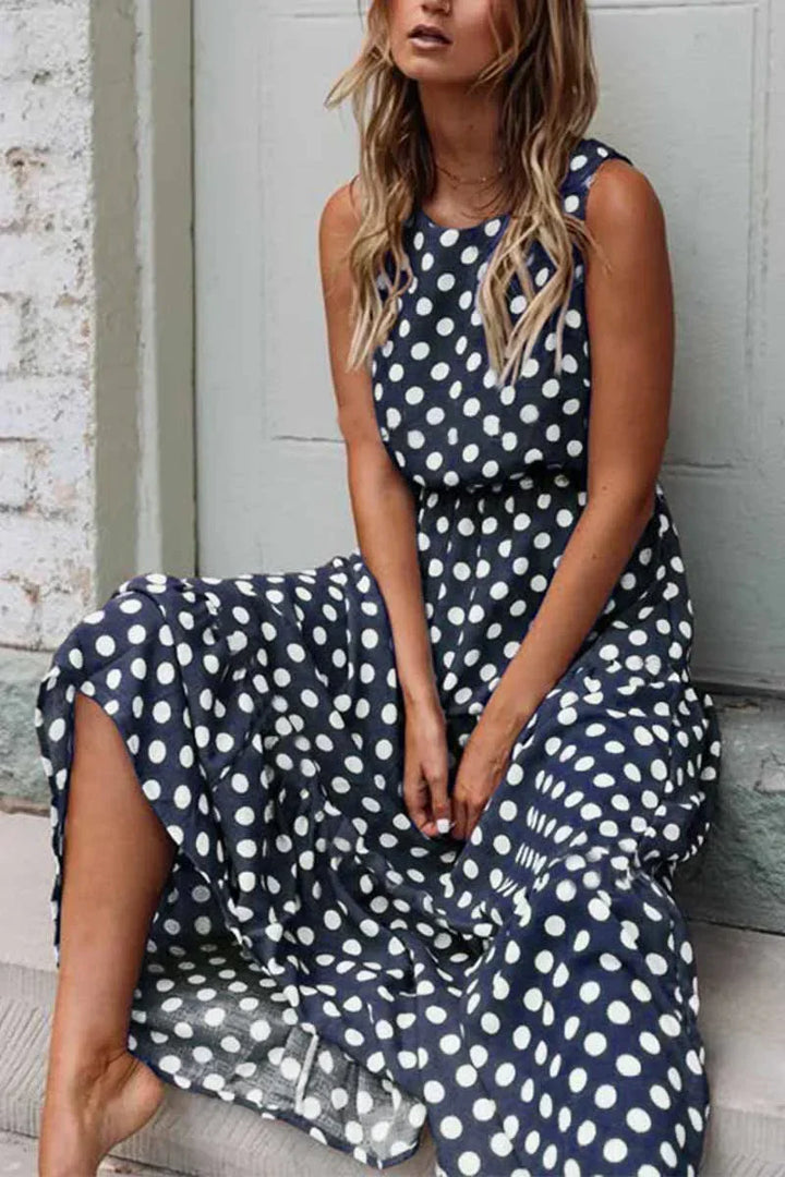 Elegant women's sleeveless polka dot maxi dress, a stylish choice for summer parties and events.