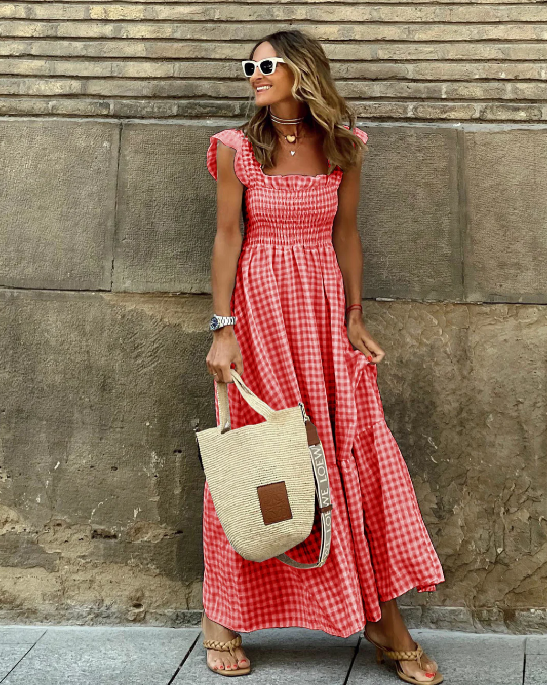 Women's elegant smocked gingham maxi dress, full-length, with fashionable ruffle sleeves, perfect for summer vacation.