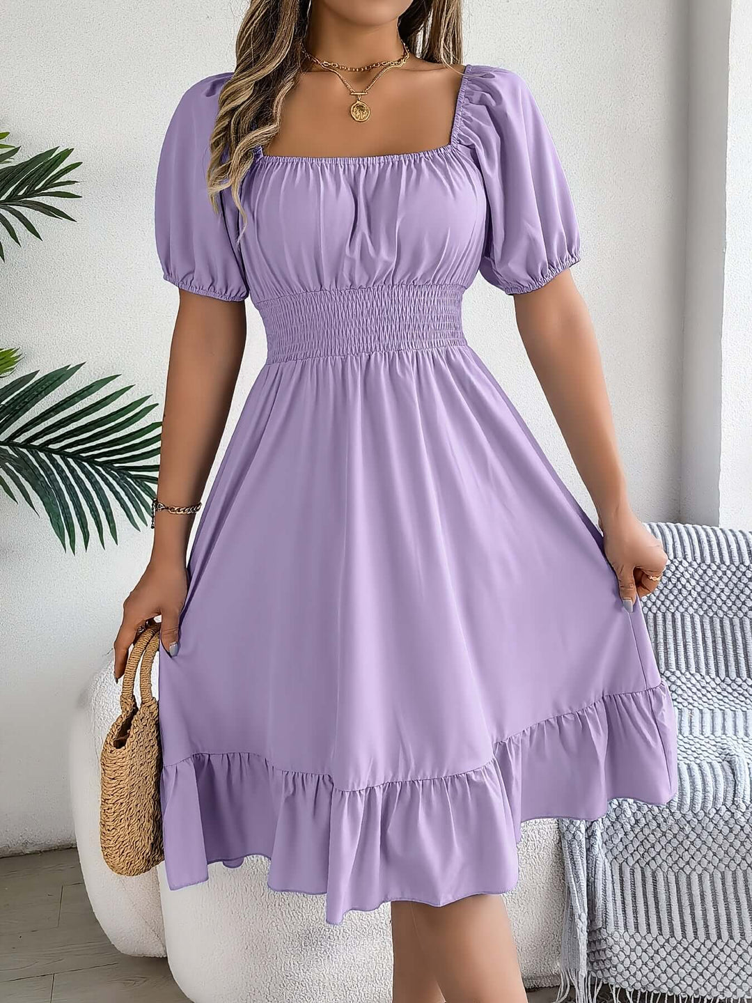Women's day dress: Smocked bodice, puff sleeves, & flowy midi skirt. Ideal for casual comfort.