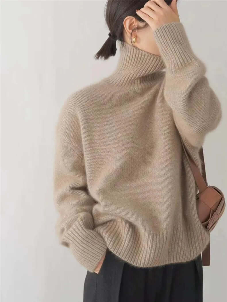 Elegant women's high neck knitted pullover sweater, featuring a soft texture, suitable for chic casual or office fall outfits.