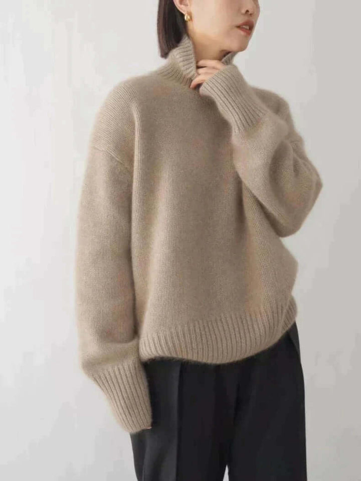 Chic women's high neck sweater, a soft knitted pullover ideal for cozy fall fashion, providing warmth and an elegant look.