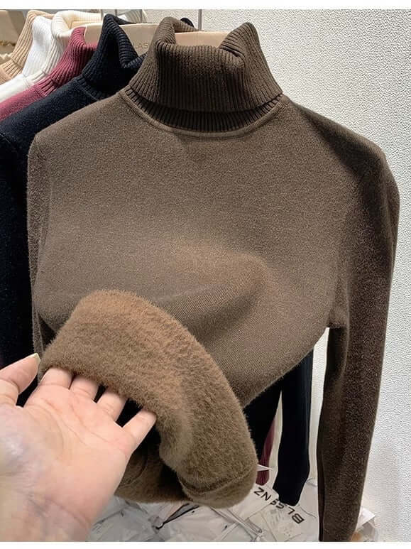 Elegant women's velvet turtleneck sweater. Chic long-sleeve design, soft and cozy for cold weather.
