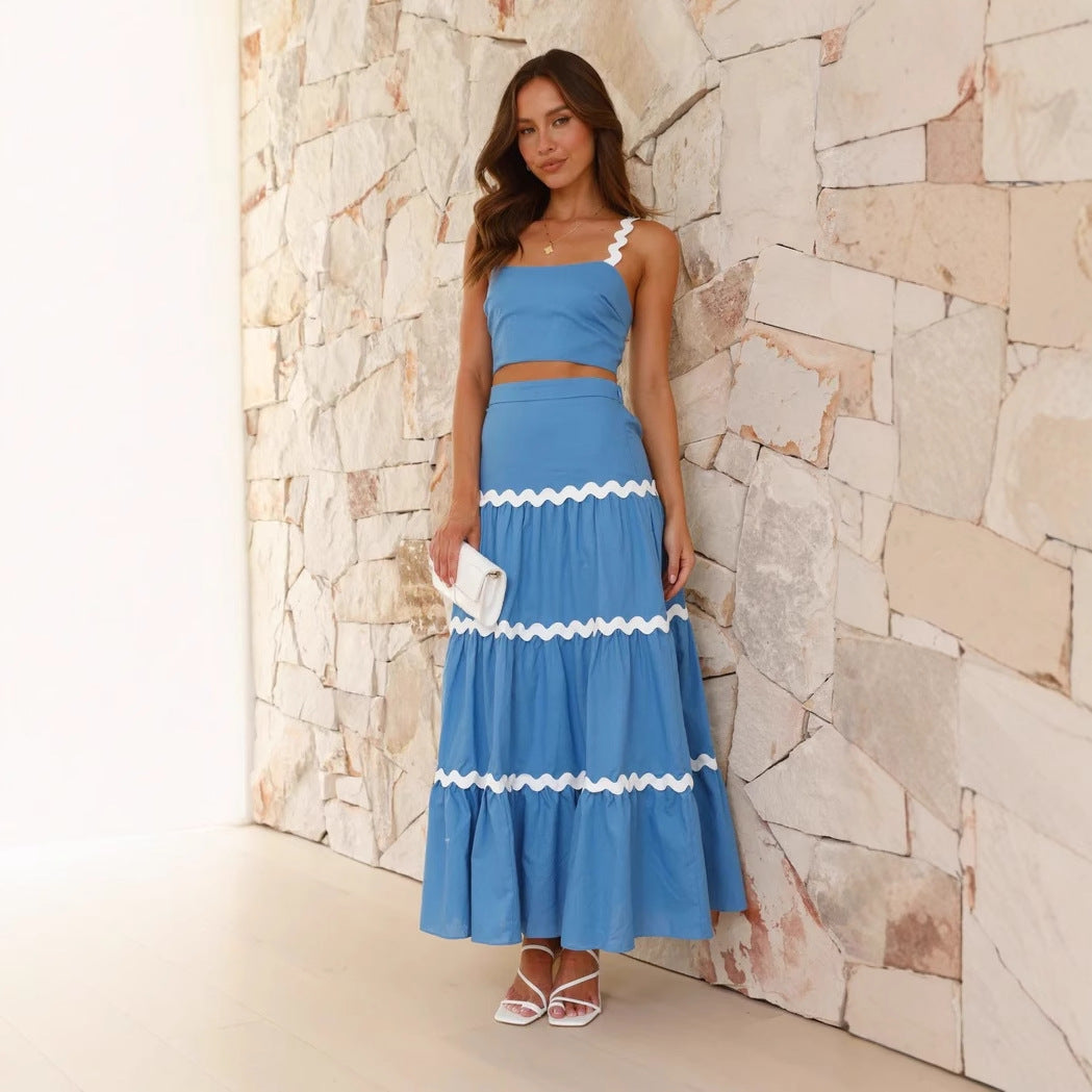 Women's strapless crop top & tiered maxi skirt set. Elegant two-piece summer outfit for vacation wear.