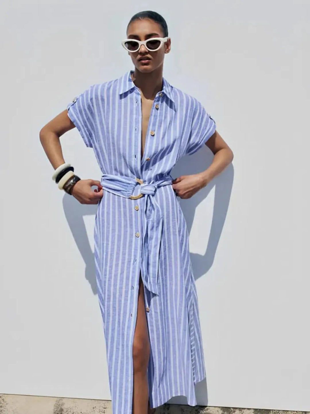 Light blue striped belted maxi dress for women, ideal for effortless summer fashion and casual work outfits.
