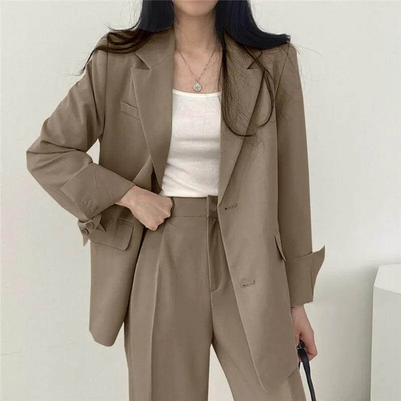 Elegant women's workwear set: tailored blazer and straight-leg pants ensemble.