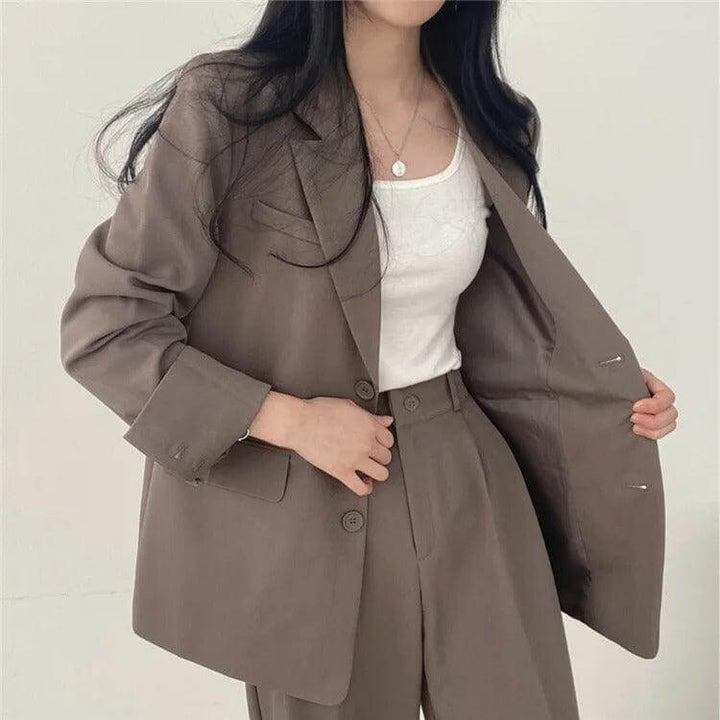 Workwear women's set featuring a sharp tailored blazer & classic straight-leg pants.