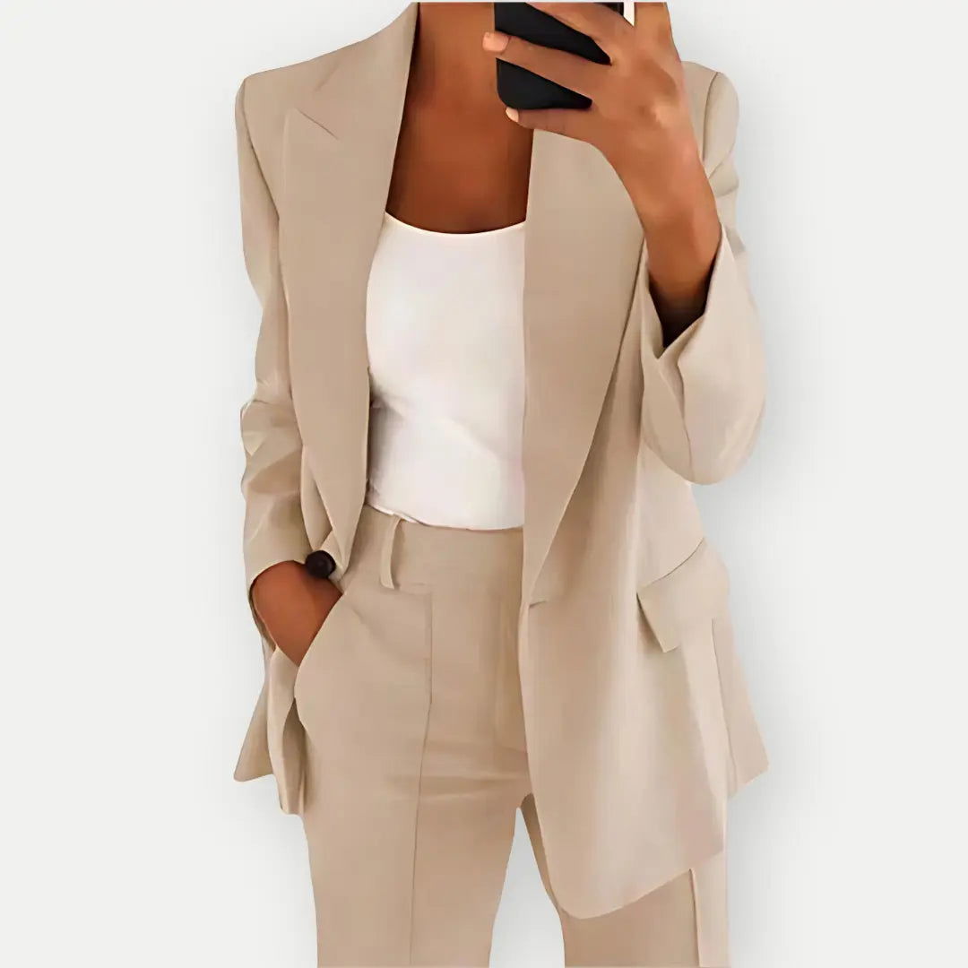Women's formal business attire: a chic tailored blazer and trouser set for professional women.