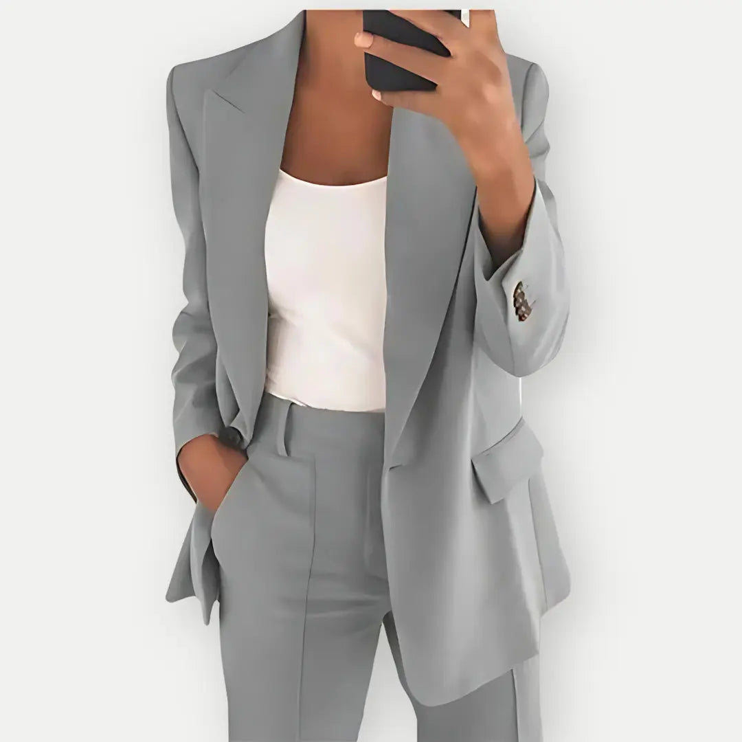 Professional women's tailored blazer and trouser suit set for office and formal events.