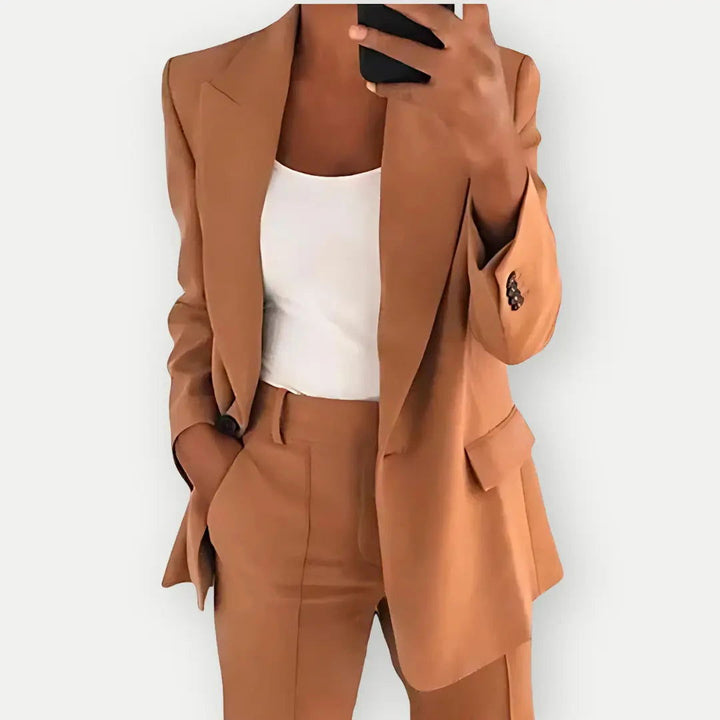 Stylish women's two-piece tailored blazer & trouser set, a modern take on professional fashion.