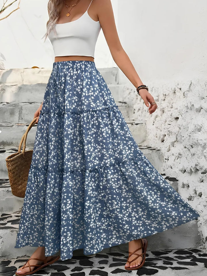 Women's tiered floral maxi skirt, a flowy long summer skirt for casual elegance.