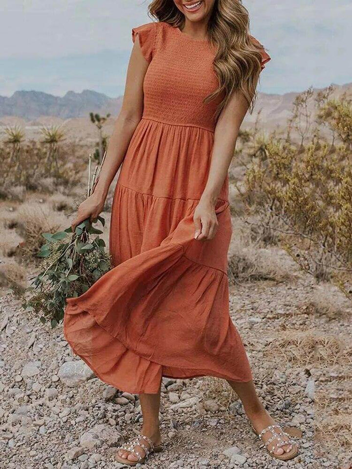 Women's tiered midi dress with elegant flutter sleeves, perfect for summer casual wear.