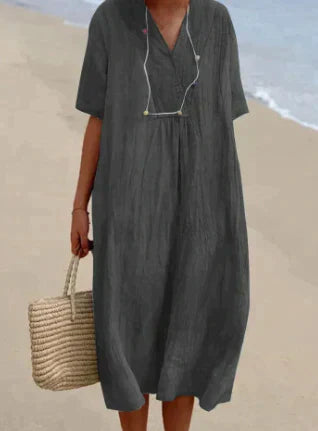Casual women's V-neck relaxed midi dress. Sleeveless, comfortable cotton for versatile everyday summer wear.