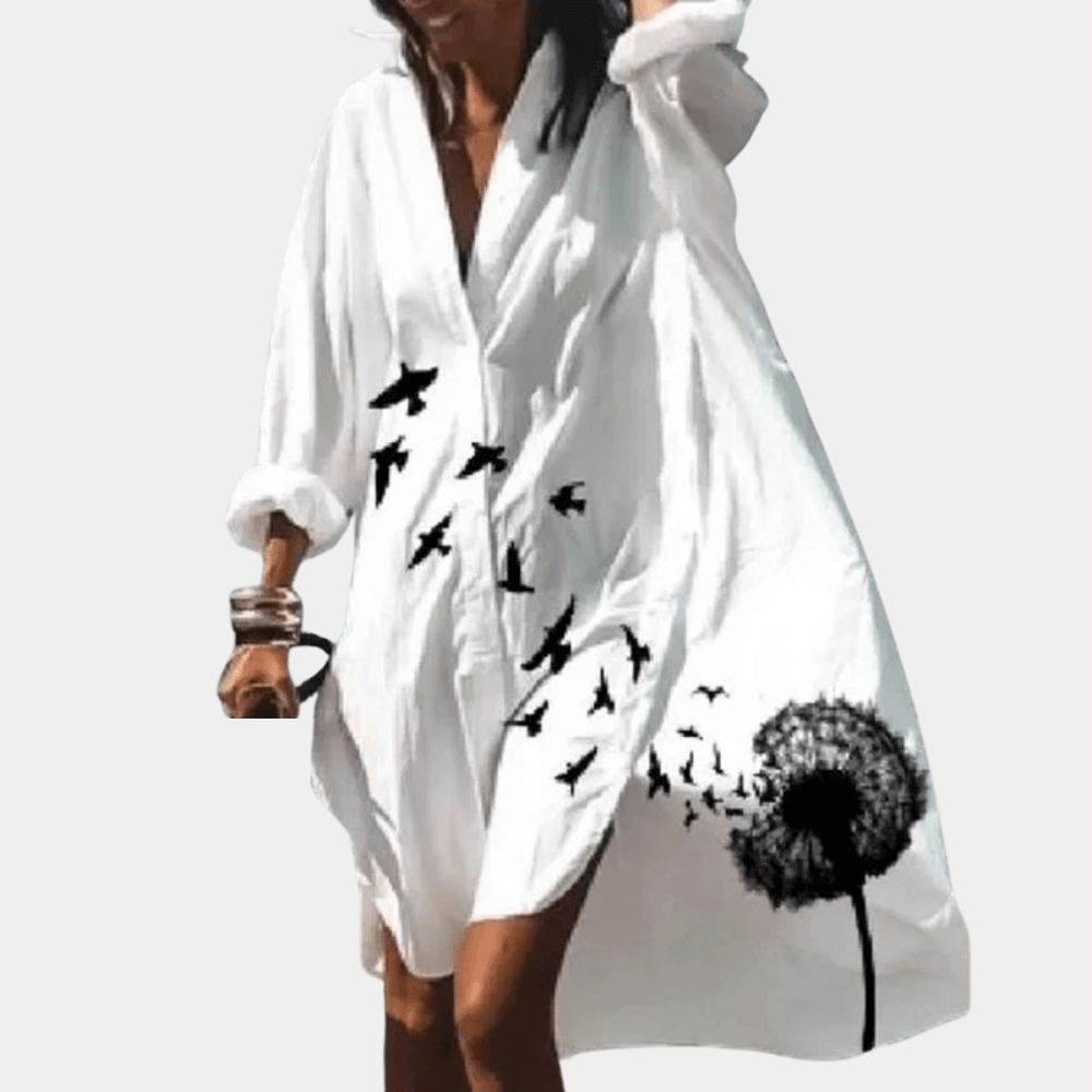 Women's elegant flowy summer dress, comfortable loose fit, vibrant print. Stylish for any casual occasion.
