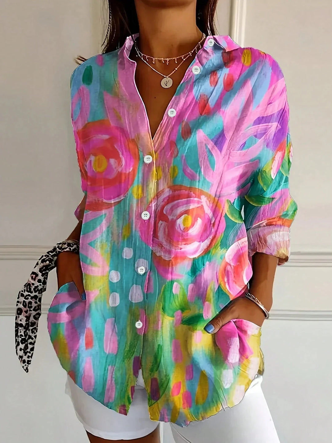 Women's vibrant playful print blouse, perfect for a chic spring or summer look.