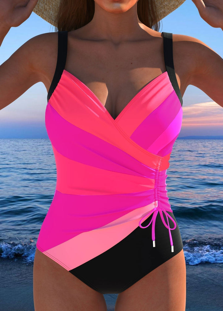 Luxe women's surplice swimsuit featuring a vibrant print. Comfortable and flattering swimwear for a stylish summer.
