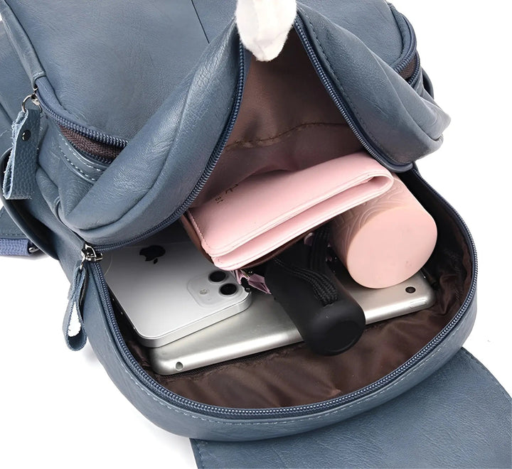Chic women's vintage leather bag, versatile as a travel or work backpack, secure & durable.
