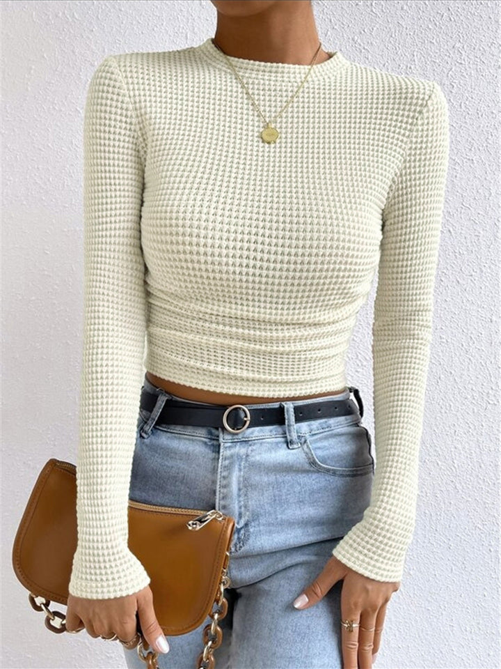 Women's waffle knit long sleeve top, crew neck, slim fit. Comfortable and versatile for everyday wear.
