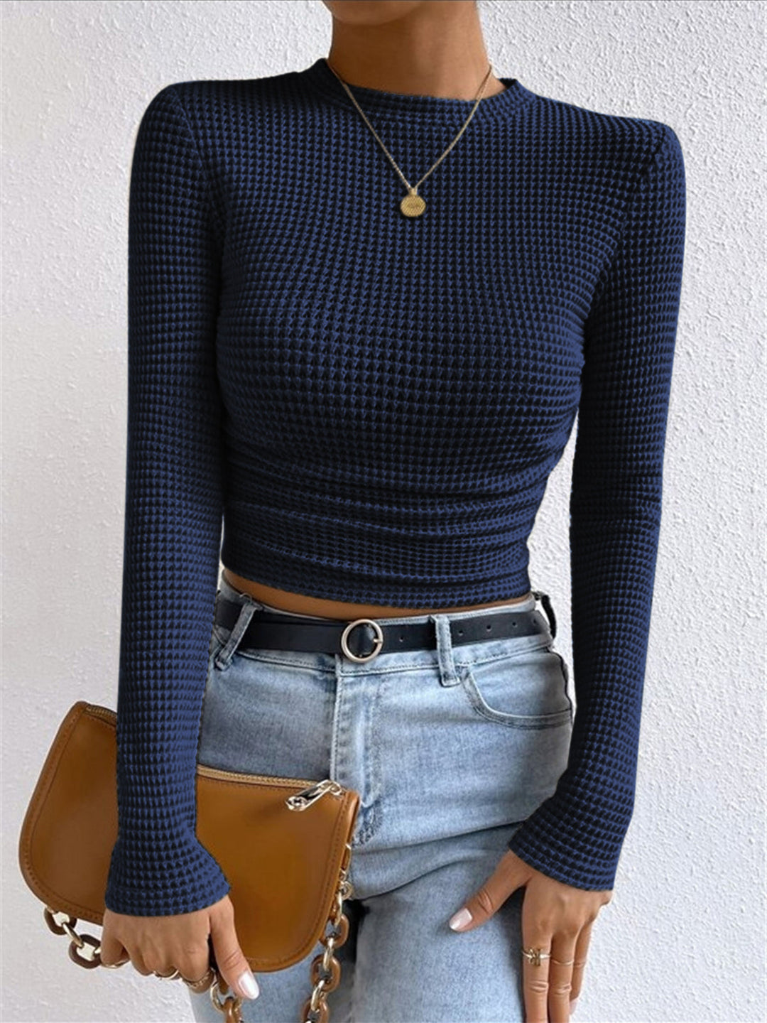 Stylish women's slim fit waffle knit long sleeve top, crew neck. A trendy, comfortable textured piece.