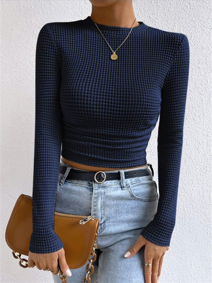Stylish women's slim fit waffle knit long sleeve top, crew neck. A trendy, comfortable textured piece.
