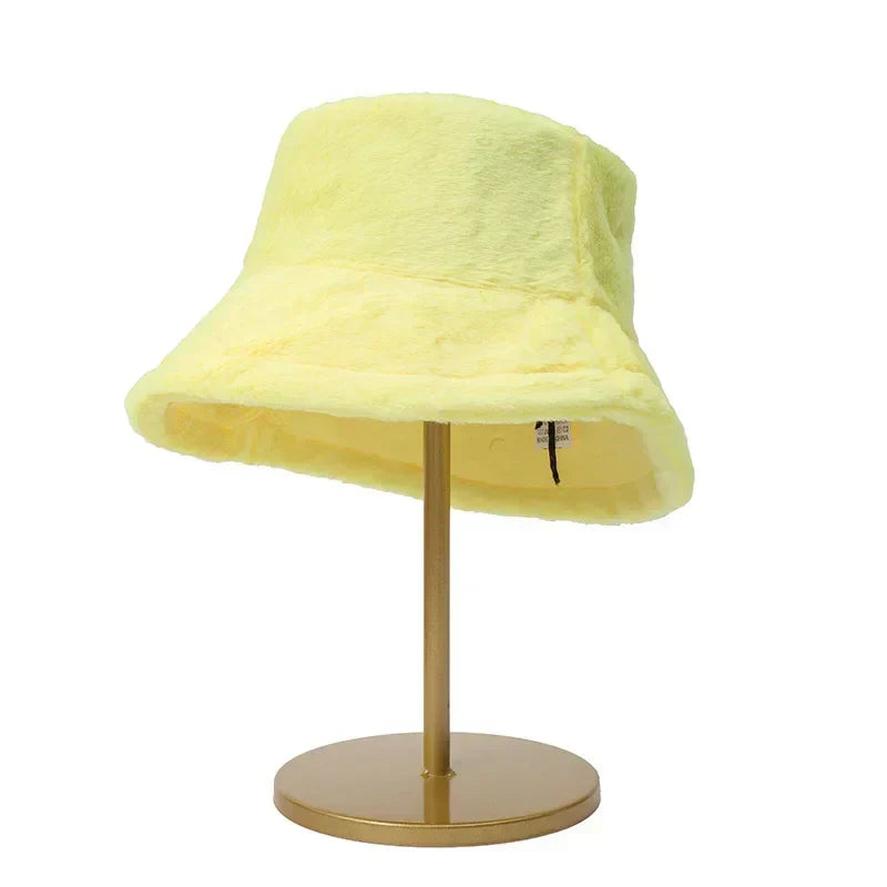 Fluffy faux rabbit fur bucket hat, a soft and warm winter accessory for women.