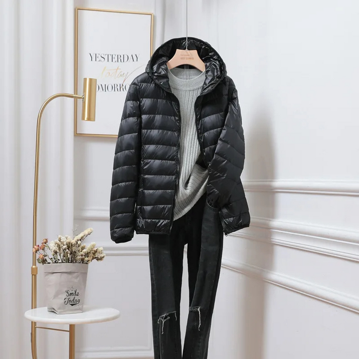 Casual women's hooded puffer jacket, ideal zip-up outerwear for autumn & winter.