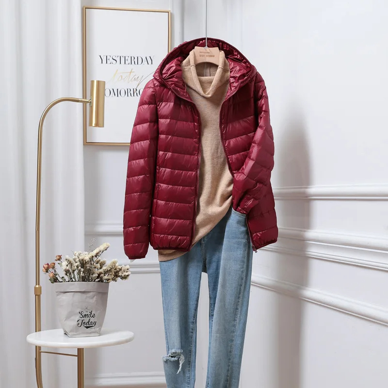 Everyday women's hooded puffer jacket, a warm zip-up winter coat for autumn & cold weather.