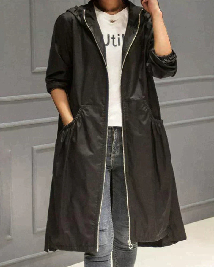 Women's hooded windbreaker rain jacket, waterproof & lightweight, designed for outdoor activities.