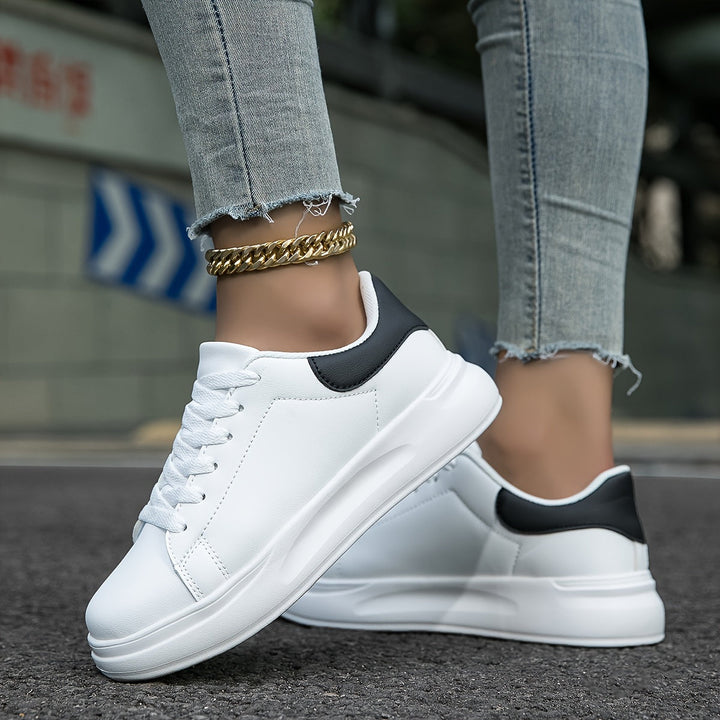 Women's white lace-up sneakers for effortless style & everyday comfort. Versatile minimalist walking shoes.