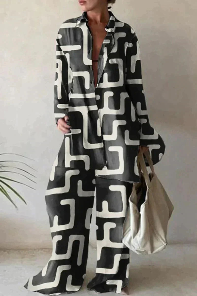 "Women's abstract printed 2-piece set with long-sleeve shirt and wide-leg pants, relaxed fit, bold pattern."