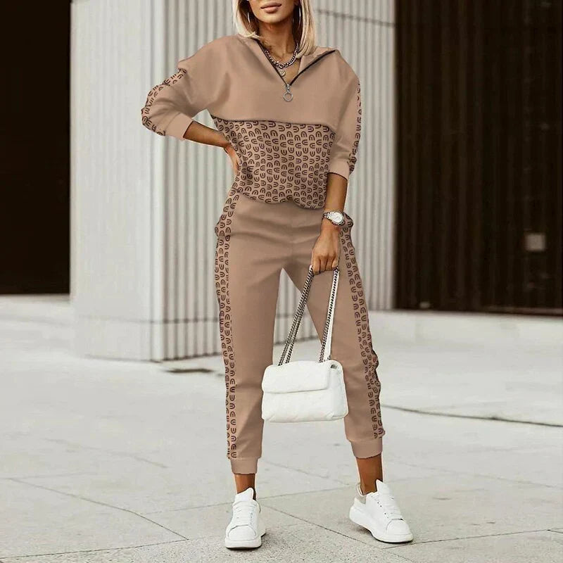 Women's athleisure set with zip hoodie and joggers, featuring a chic patterned design in cosy, breathable fabric.
