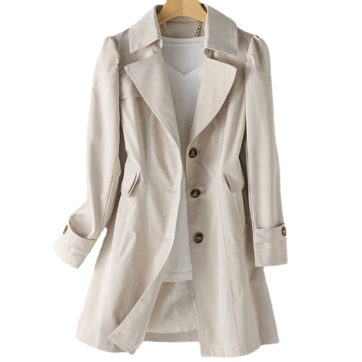 "Women's beige trench coat, water-resistant, mid-length, with adjustable waist belt and classic design for stylish protection