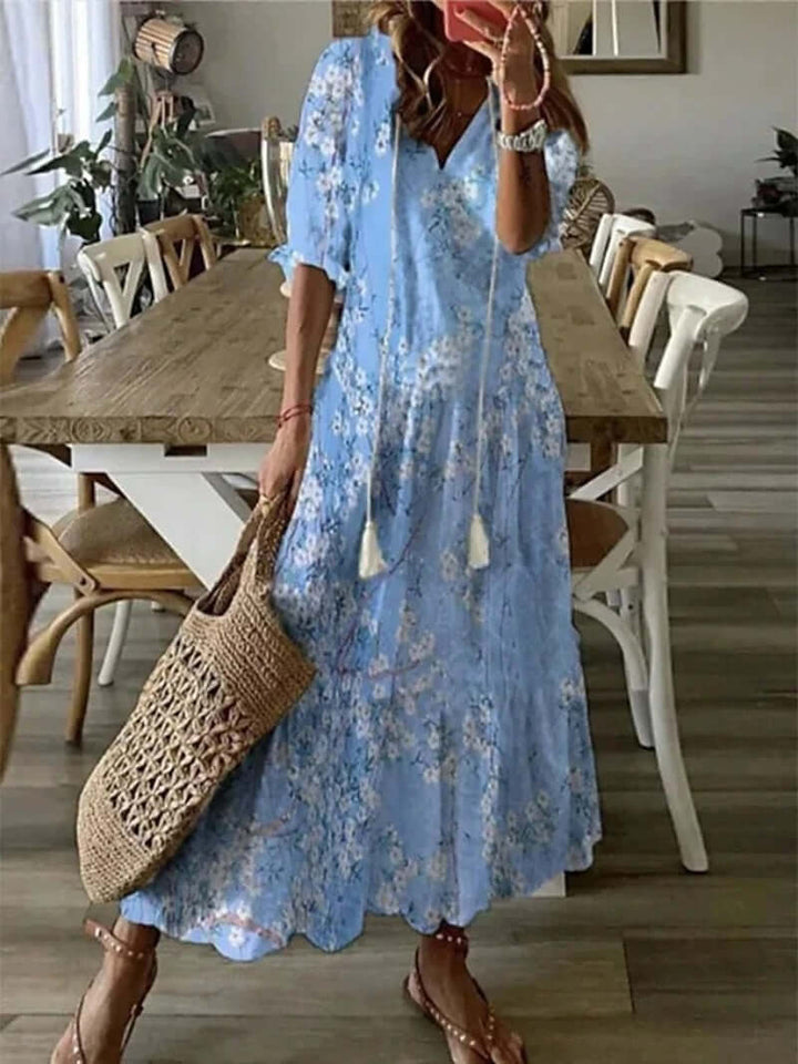 "Women's Bohemian Maxi Dress, V-neck, loose fit, with tie details in colorful print, perfect for summer elegance."