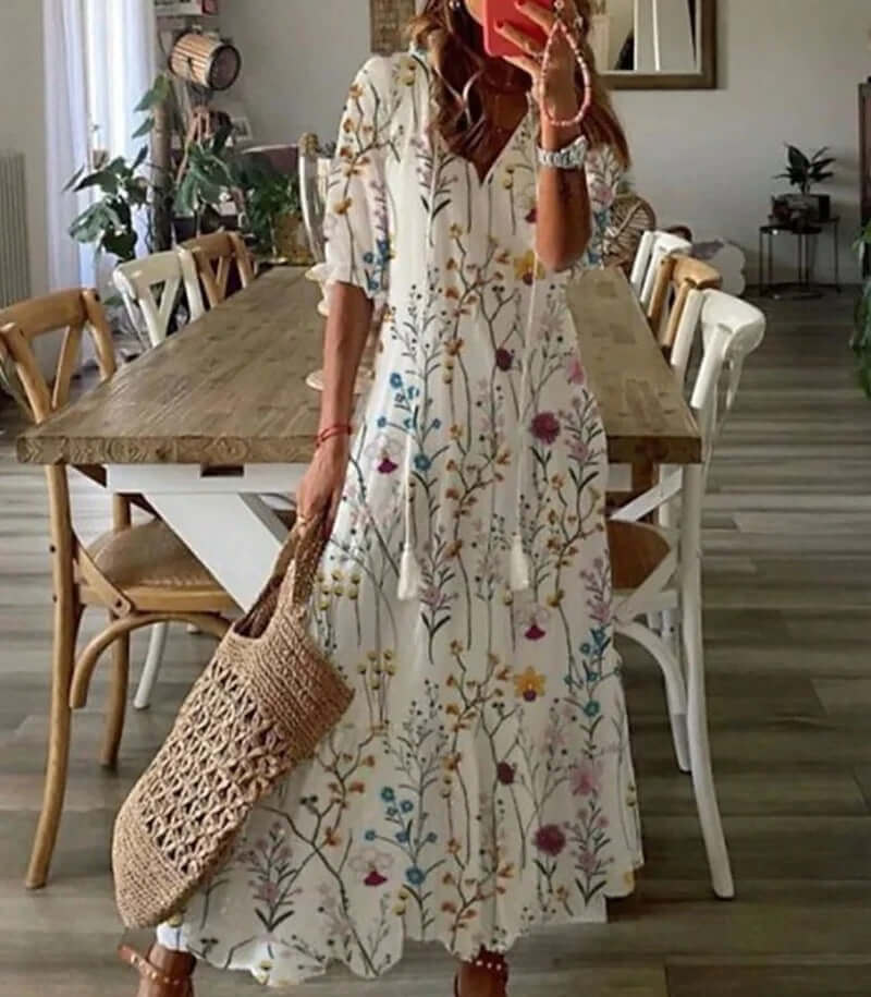 "Women's Bohemian Maxi Dress, V-neck, loose fit, with tie details in colorful print, perfect for summer elegance."