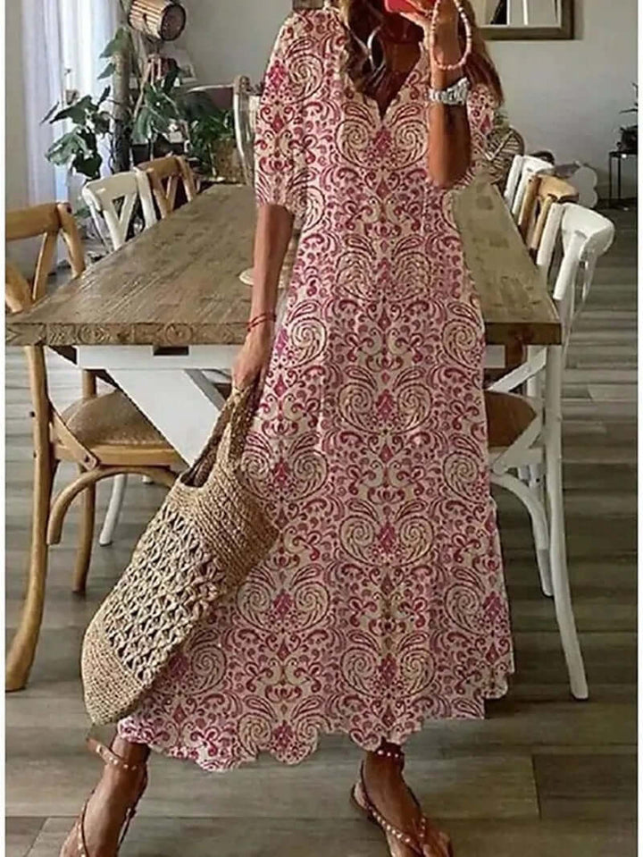 "Women's Bohemian Maxi Dress, V-neck, loose fit, with tie details in colorful print, perfect for summer elegance."