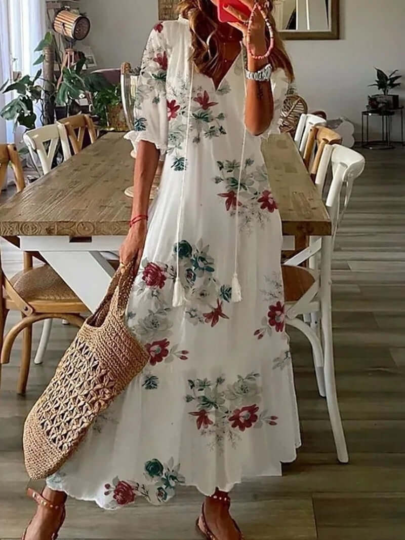 "Women's Bohemian Maxi Dress, V-neck, loose fit, with tie details in colorful print, perfect for summer elegance."