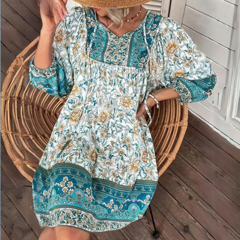 "Women's boho floral summer dress, knee-length, long sleeves, relaxed fit, perfect for sunny days."