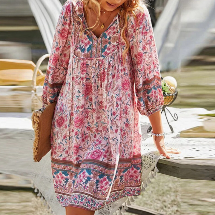 "Women's boho floral summer dress, knee-length, long sleeves, relaxed fit, perfect for sunny days."