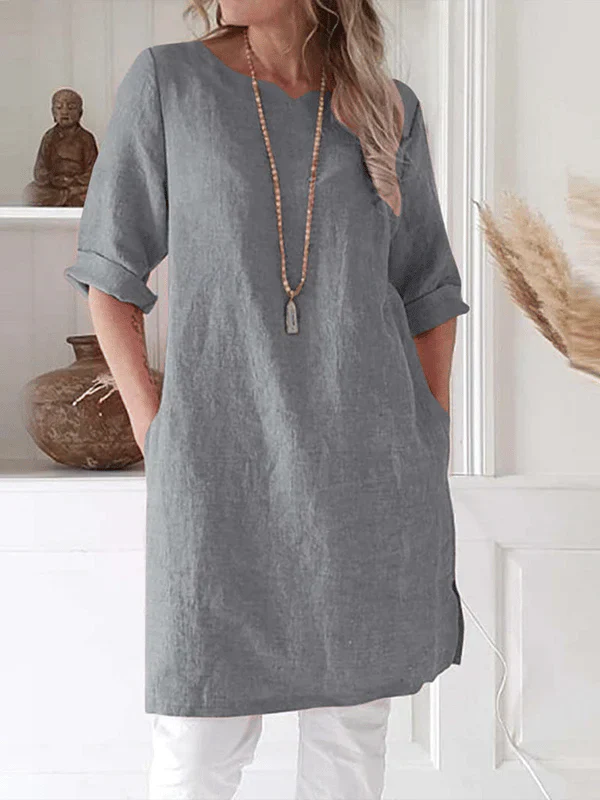"Women's breathable linen tunic dress with relaxed fit and rolled 3/4 sleeves, featuring soft fabric for stylish comfort."