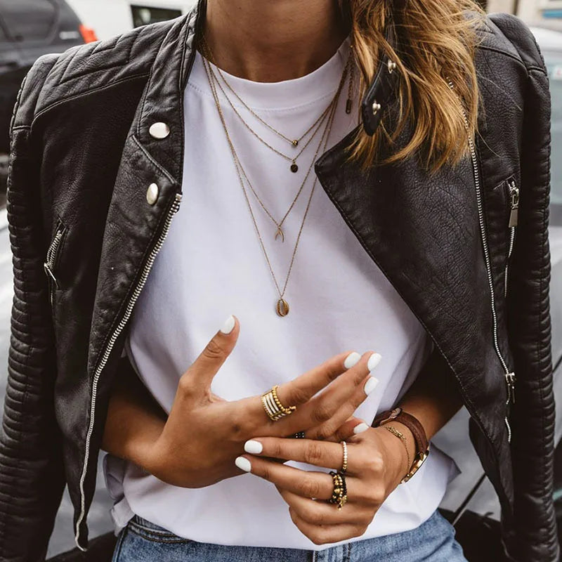 Women's casual black vegan leather biker jacket with long sleeves and chic style, perfect for sustainable fashion.
