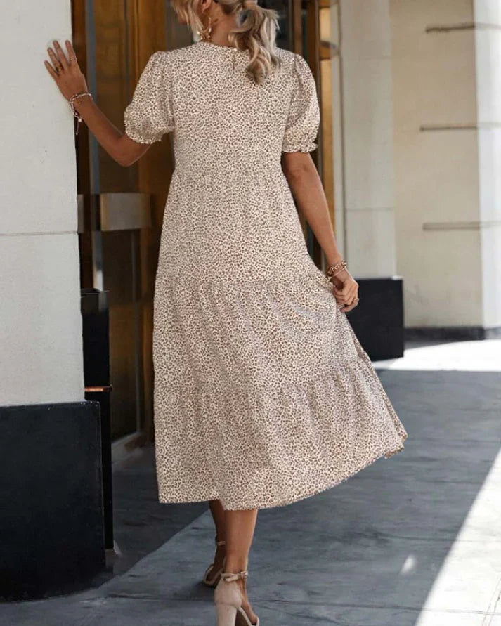 Women's casual boho midi dress with puff sleeves, soft print, and ruffle hem, creating an elegant silhouette.