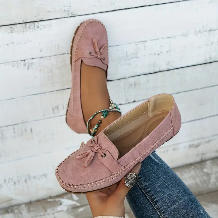 "Women's classic bow loafers in soft suede, stylish flat slip-ons with elegant bow accent, ideal for any occasion."